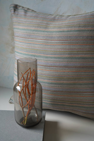 Handwoven cushion cover in tropical hued stripes