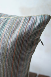 Handwoven cushion cover in tropical hued stripes